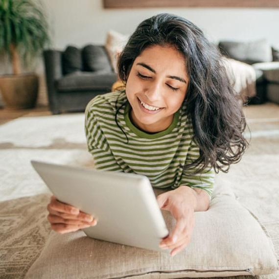 Caucasian female high school student doing schoolwork online - Connections Academy